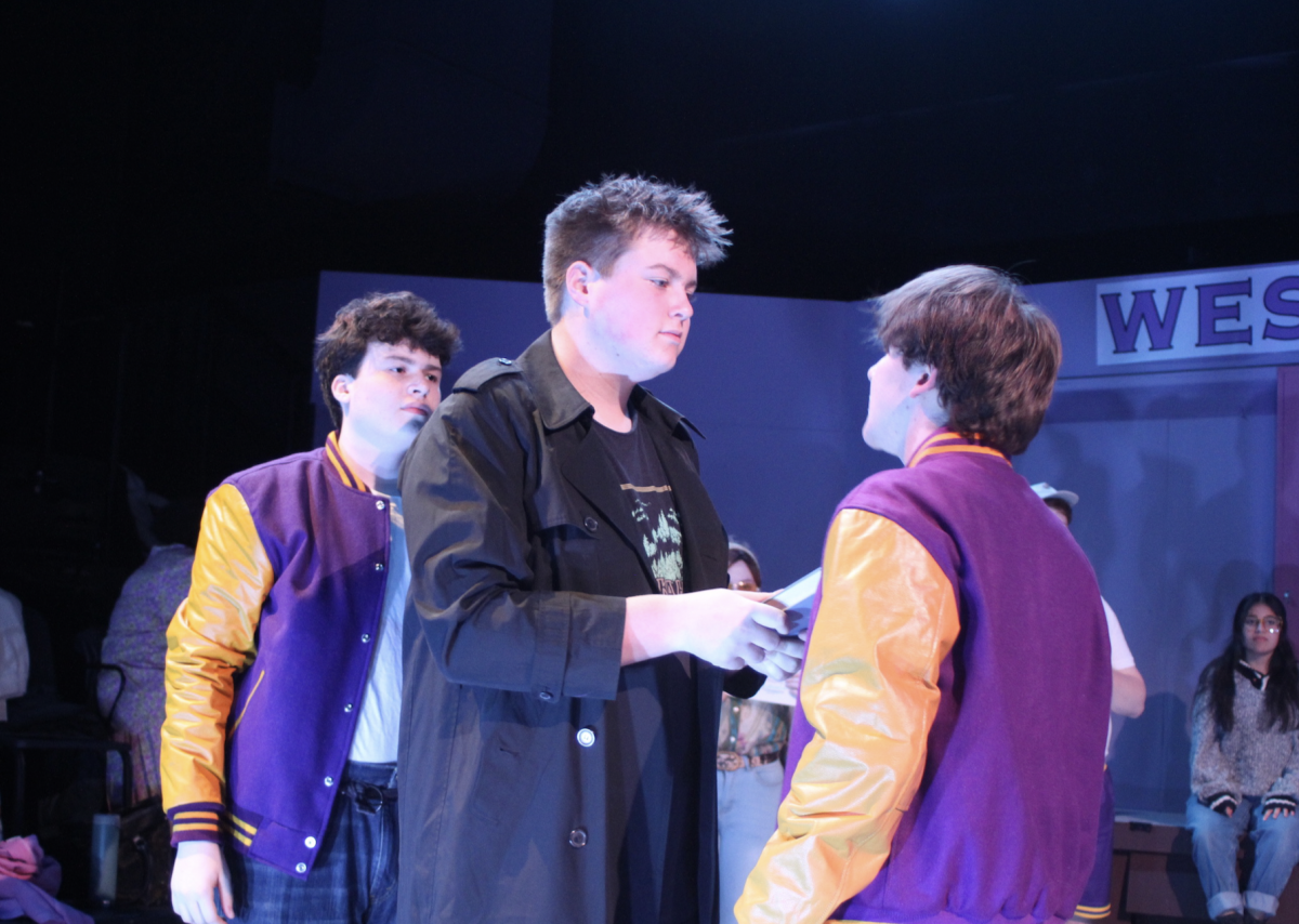 Seniors Nate Burres and Toby Gilpin, and Sophomore Alex Santanastaso,  perform in a dress rehearsal of Heathers: Teen Edition, Saturday, Nov. 23. 